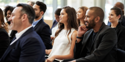 People sitting at a conference.