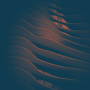 A blue background with orange waves in a pattern.