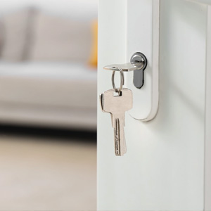 A key is inserted into a door handle